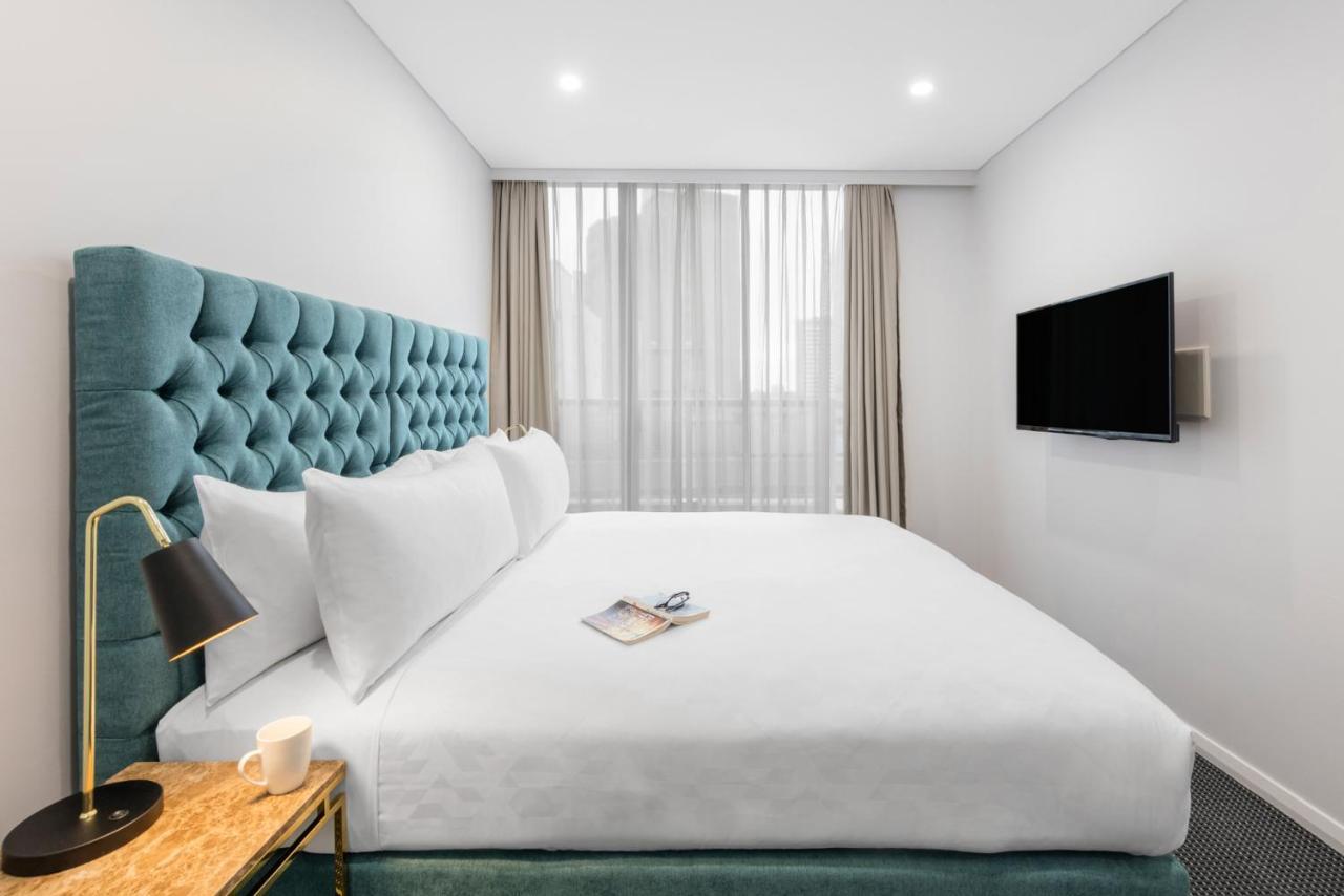 Meriton Suites Pitt Street, Sydney Eksteriør bilde A bedroom at the hotel