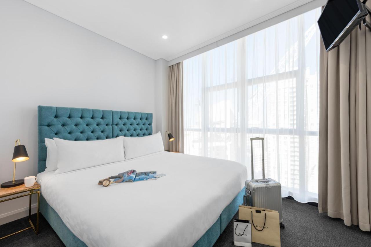 Meriton Suites Pitt Street, Sydney Eksteriør bilde A bedroom at the hotel