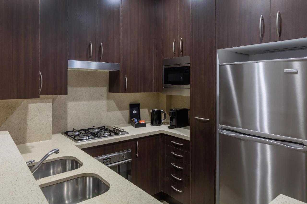 Meriton Suites Pitt Street, Sydney Eksteriør bilde A typical kitchen in a serviced apartment